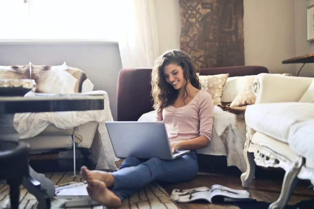 home-based business, work from home, Woman Smiling While Using Laptop