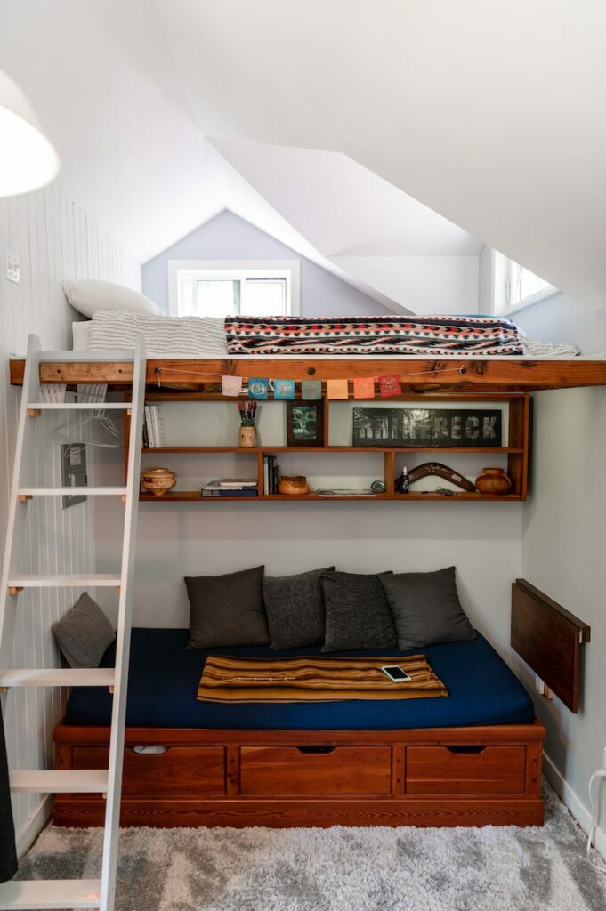 studio house, studio shed, a loft bed with a ladder to the top of it